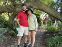 INtern Tanner Collier and Agent Sarah Christas standing in front of tree