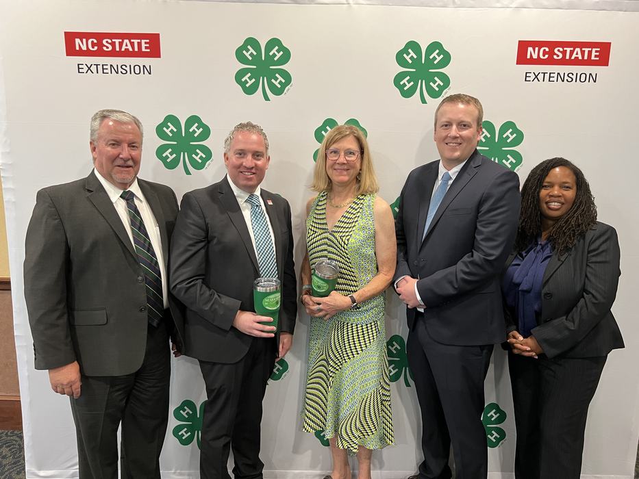 Orange County 4-H Staff Smith and Rogers receiving award from NCAE4-HYDP in Concord in August 2024