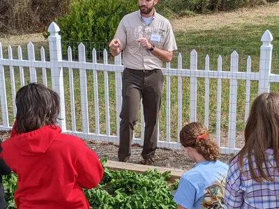 Agriculture agent teaching kids