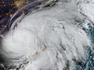 Large hurricane over Florida and the southeastern U.S., broad cloud bands visible