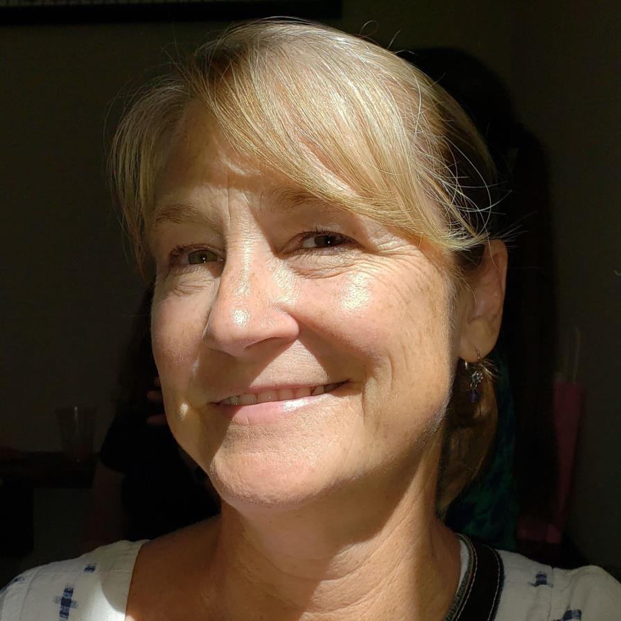 A portrait photograph of a woman smiling.