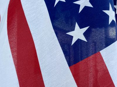 American flag showing blue field with white stars and red and white stripes
