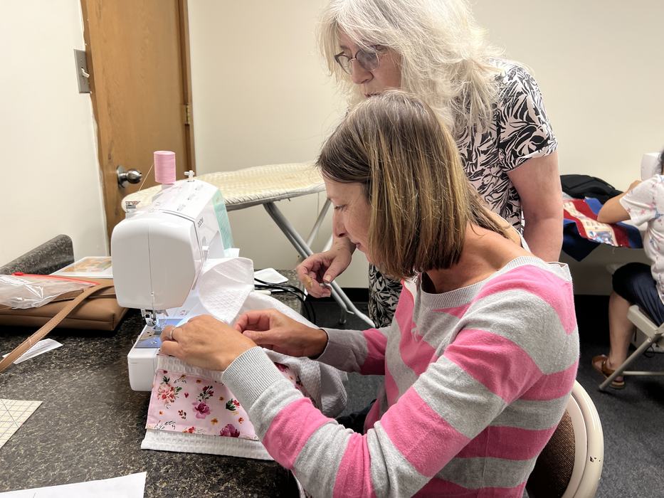 Tamra Dunn, Instructor teaching student, Val Davis to Sew