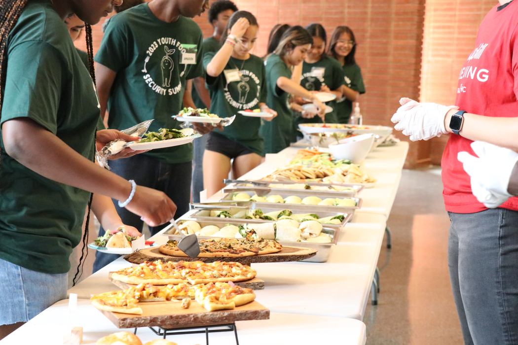 Kids line up for food served buffet style.