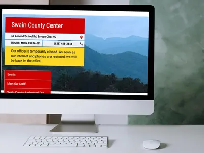Desktop computer monitor with screenshot of closure message