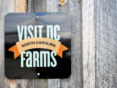 Advertisement sign for Visit NC Farms App