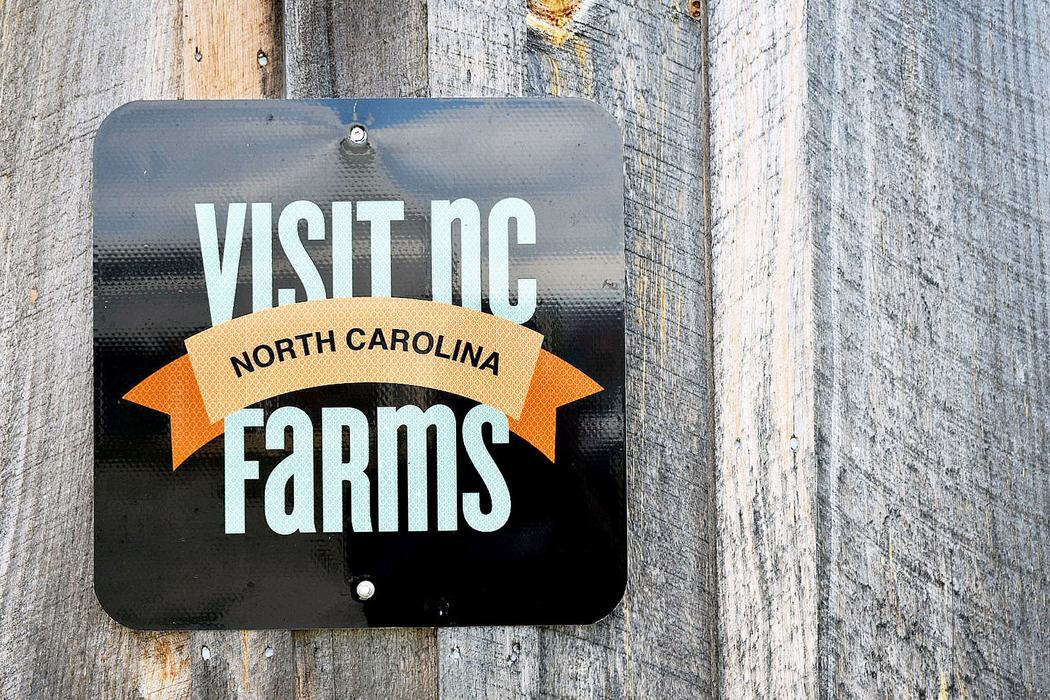 Visit NC Farms app advertisement sign.