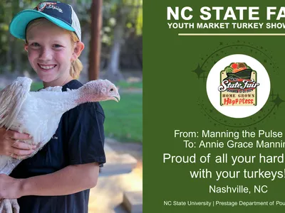 message board example. child holding his turkey with good luck wishes from his parents