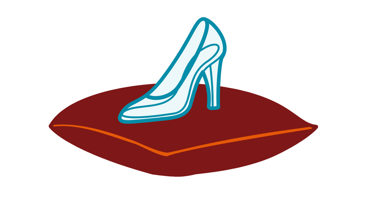 Crystal slipper on a pillow.