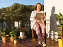 person with an iPad outdoors