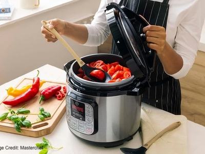 Person preparing tomatoes in a multicooker