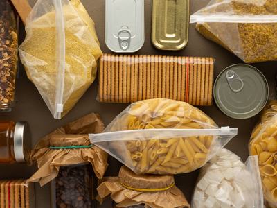 Assorted pantry staples: pasta, crackers, granola, grains, coffee and canned goods