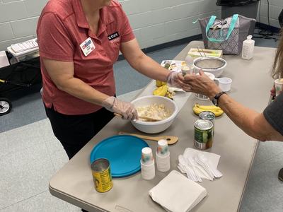 Chrissy serving food samples