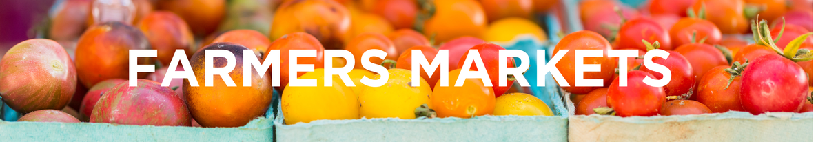 Heirloom tomatoes in cartons with overlaid text "FARMERS MARKETS"