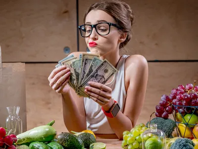 Woman counts money for food