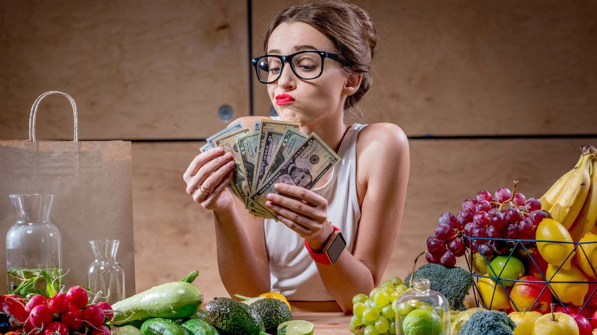 Woman counts money for food