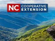 Mountain ridge and trail with "NC Cooperative Extension" logo