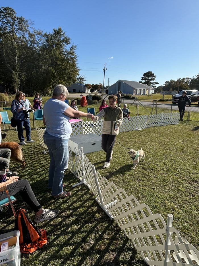Mason Meroff and his canine companion, Teddy receiving their 2nd place ribbon in the best trick contest