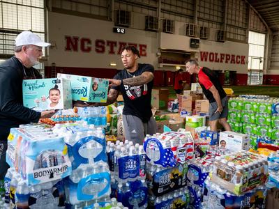 Volunteers collect water donations as part of NC State's Hurricane Helene relief efforts.