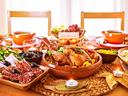 Thanksgiving table with turkey and food