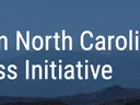 Text "Western North Carolina Small Business Initiative" over layered blue mountain background