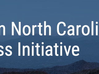 Text "Western North Carolina Small Business Initiative" over layered blue mountain background