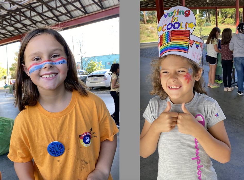 Children with facepaint and stickers supporting voting.