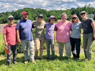 a group of people standing in a field