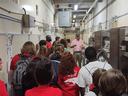 group on a tour through industrial building