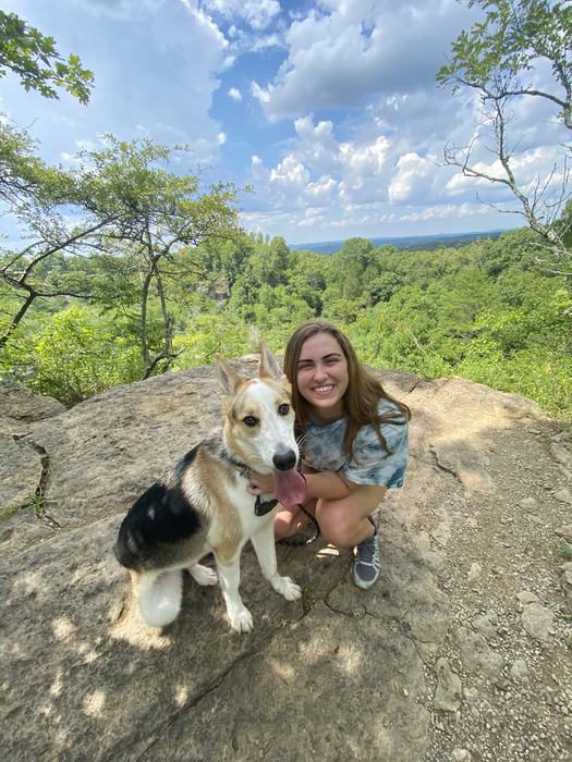 Image of Sarah Cain hiking with her dog.