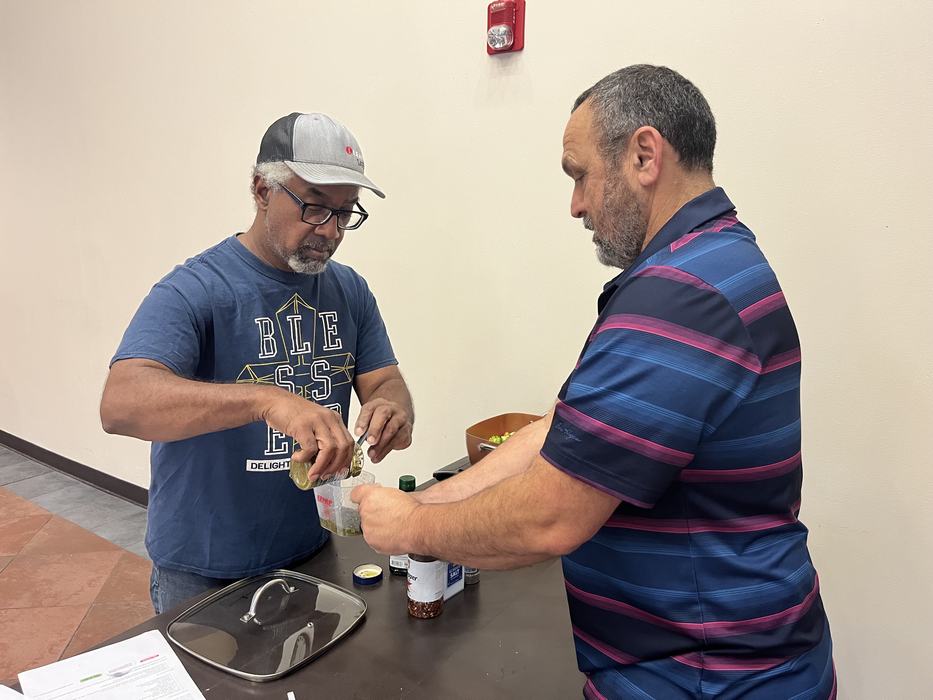 two participants working together to measure something