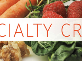 Carrots, raspberries, spinach and walnuts with overlaid text "SPECIALTY CROPS"