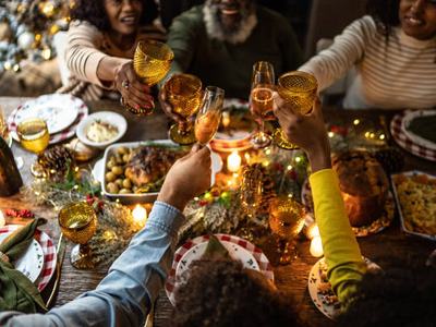 Family toasting on Christmas dinner at home