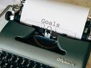 typewriter with the word goals typed on a paper