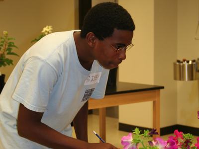 young man judging flowers
