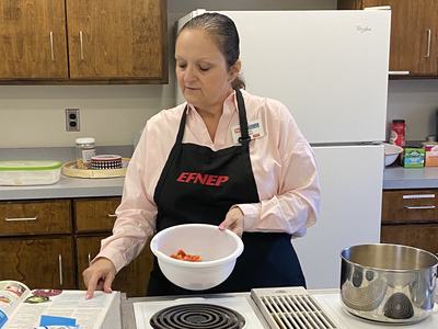 Chrissy making a recipe
