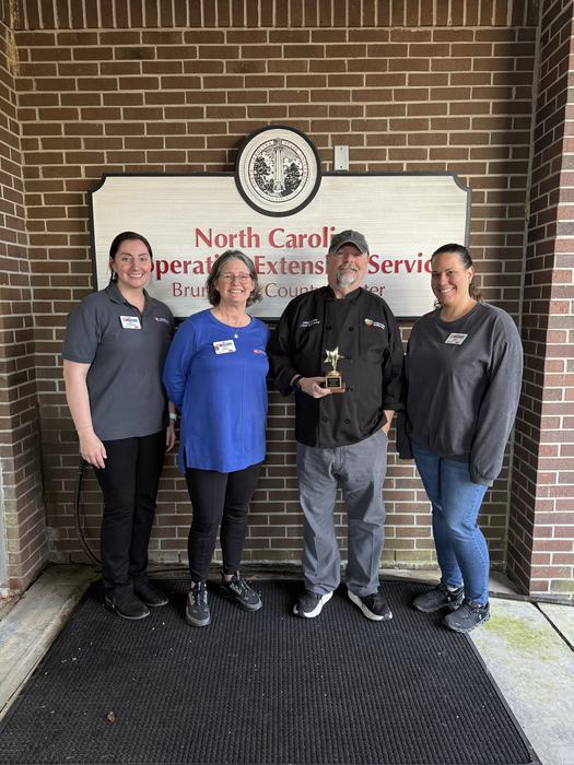 From left to right: Emily Pendergrass (Regional Nutrition Extension Associate) Angie Lawrence (EFNEP Nutrition Educator, 4-H Program Assistant) Chef John LaTour, and Jamie Lester (4-H Youth Development Agent).