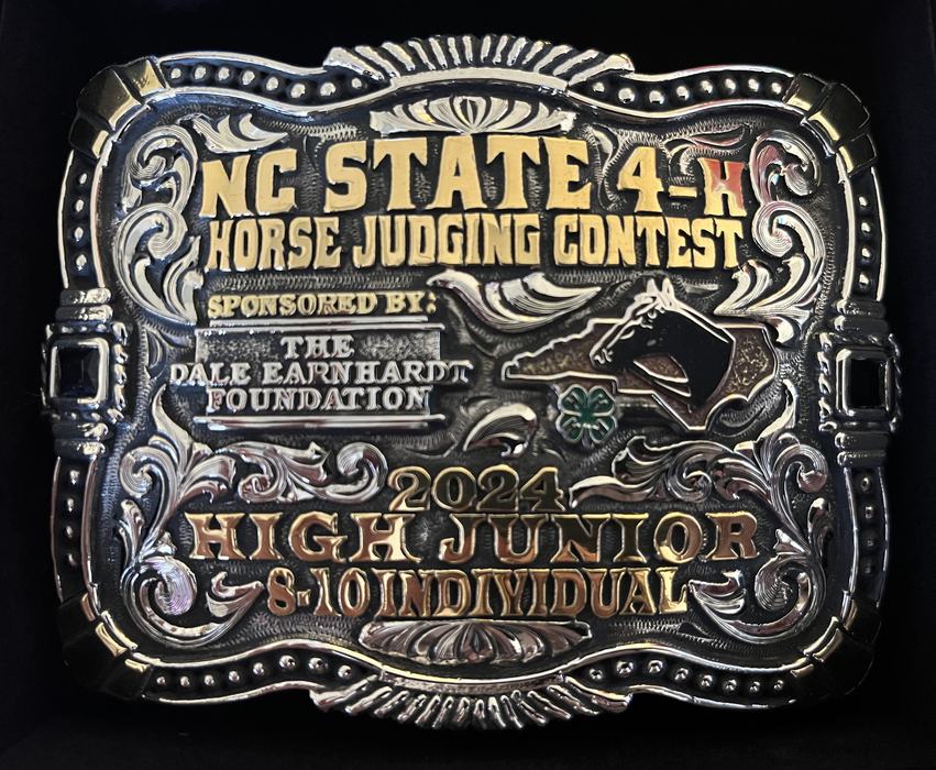Belt buckle reading NC STATE 4‑H HORSE JUDGING CONTEST, 2024 HIGH JUNIOR 8–10 INDIVIDUAL