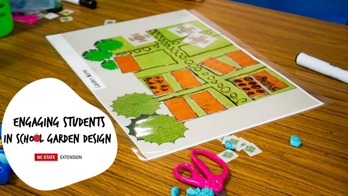 Garden design plan on table with pink scissors; text: 'Engaging Students in School Garden Design'