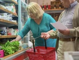 man and woman grocery shopping