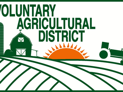 Voluntary Agricultural District Logo that features a cartoon image of a farm