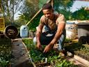 Young Black Farmer with plants