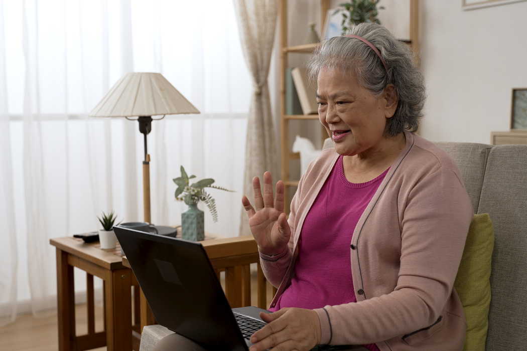 older adult on a computer