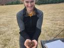 Young woman holding a handful of truffles recently harvested from a truffle orchard in North Carolina