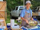 Margie Mansure, NC State Extension FCS agent in Watauga and Caldwell counties, offers up a tasty, healthy dish made with local ingredients at a farmers market.