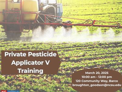 Tractor spraying a field