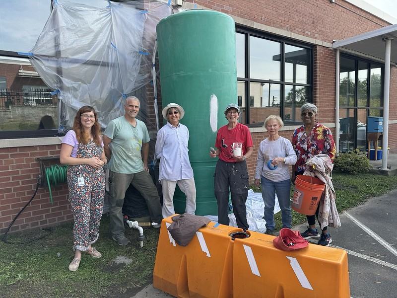 Master Gardeners preparing to paint the cisterns