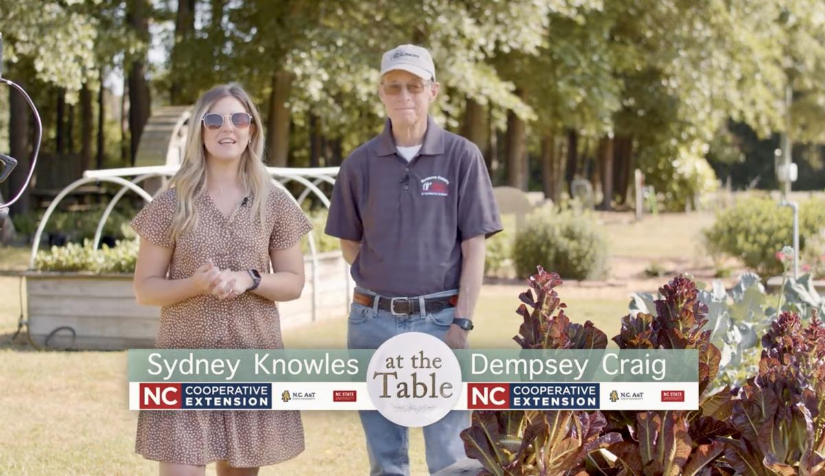 Sydney Knowles and Dempsey Craig in a garden.