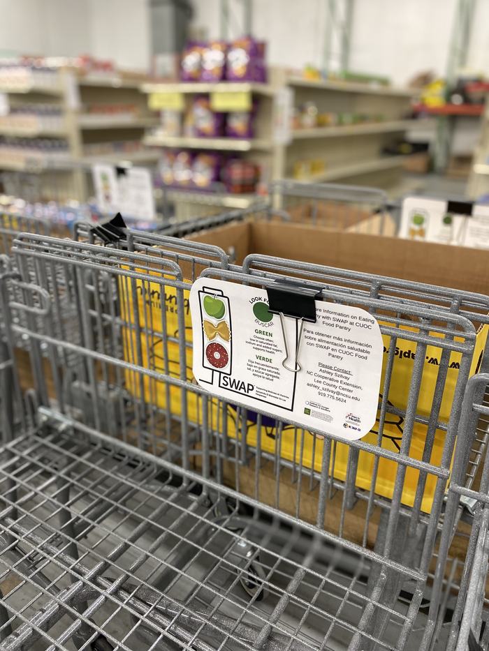 A SNAP card affixed to a shopping cart.