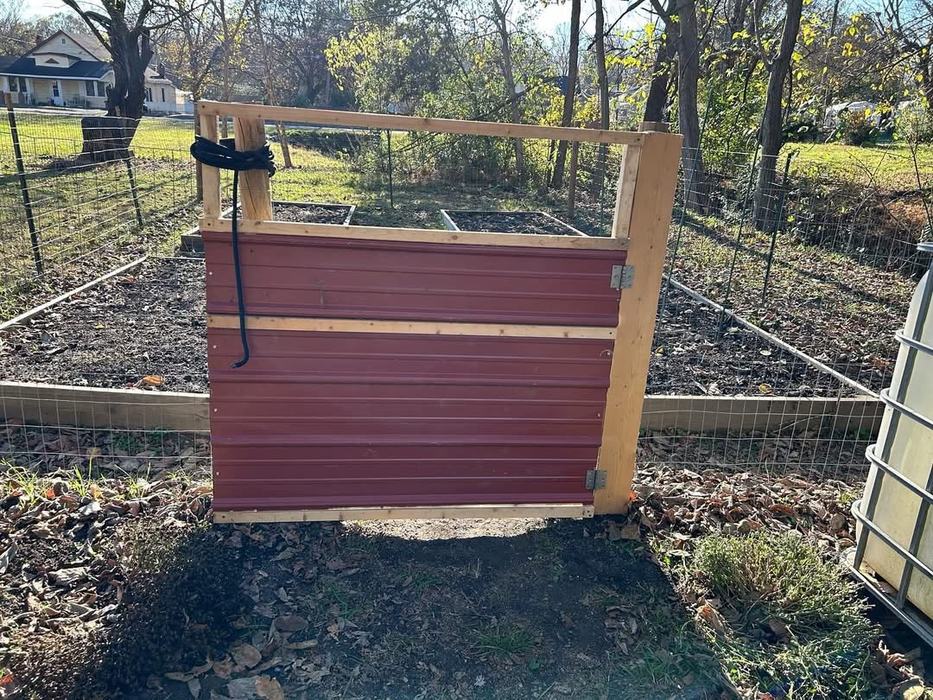 A gate protects a garden.